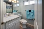 The hall bathroom has shower/tub combo and serves the twin bdrm and living area.  